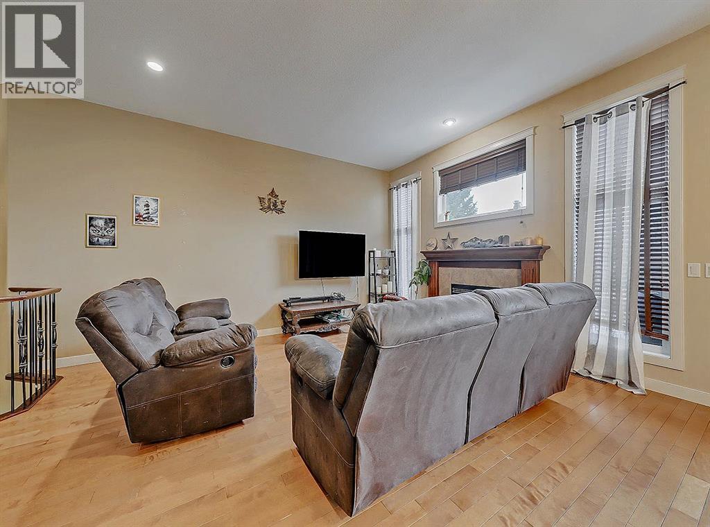 308 Lineham Acres Drive Nw, High River, AB - Indoor Photo Showing Living Room With Fireplace