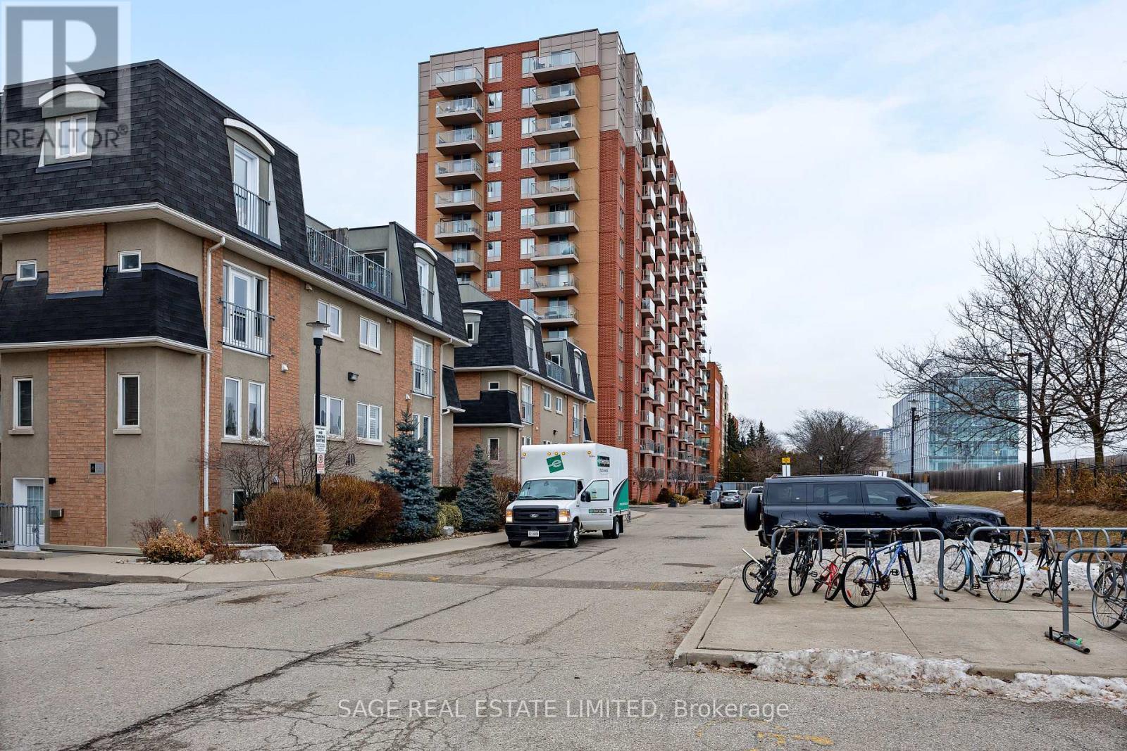 144 - 30 Merchant Lane, Toronto, ON - Outdoor With Balcony With Facade