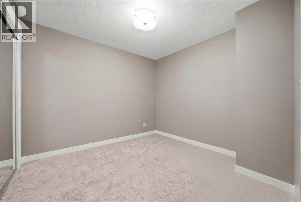 Second room unfurnished - 2118, 11 Mahogany Row Se, Calgary, AB - Indoor Photo Showing Other Room