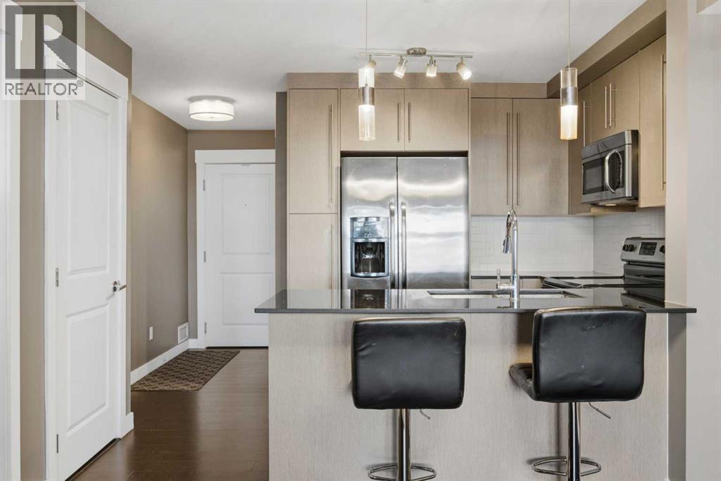 Breakfast bar - 2118, 11 Mahogany Row Se, Calgary, AB - Indoor Photo Showing Kitchen With Upgraded Kitchen