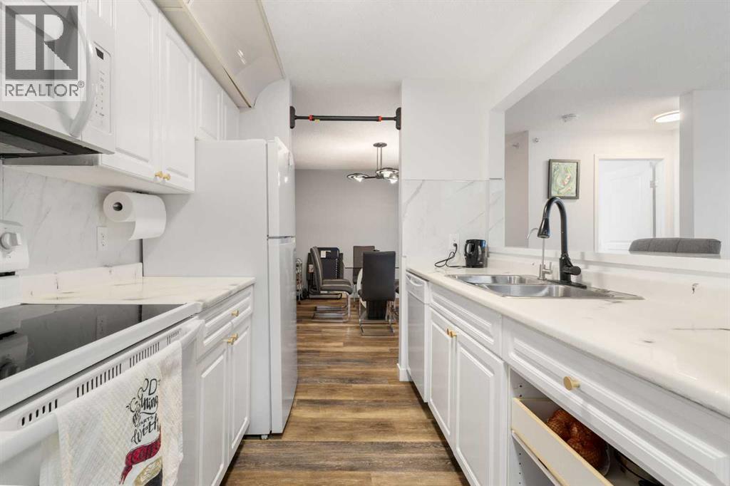 510, 55 Arbour Grove Close Nw, Calgary, AB - Indoor Photo Showing Kitchen With Double Sink
