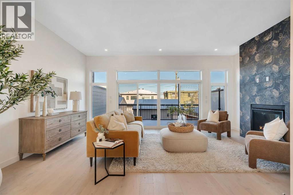 2436 30 Avenue Sw, Calgary, AB - Indoor Photo Showing Living Room With Fireplace