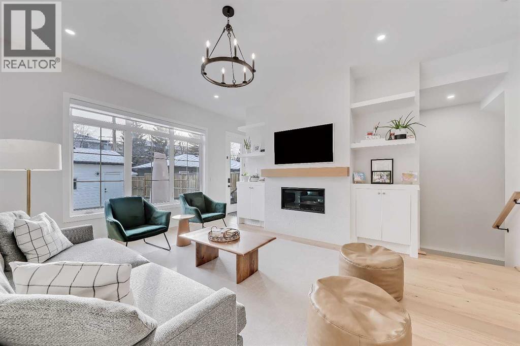 619 55 Avenue Sw, Calgary, AB - Indoor Photo Showing Living Room With Fireplace