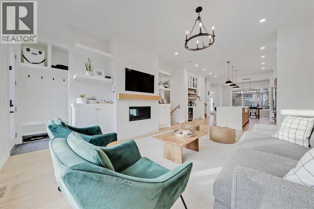 619 55 Avenue Sw, Calgary, AB - Indoor Photo Showing Living Room With Fireplace