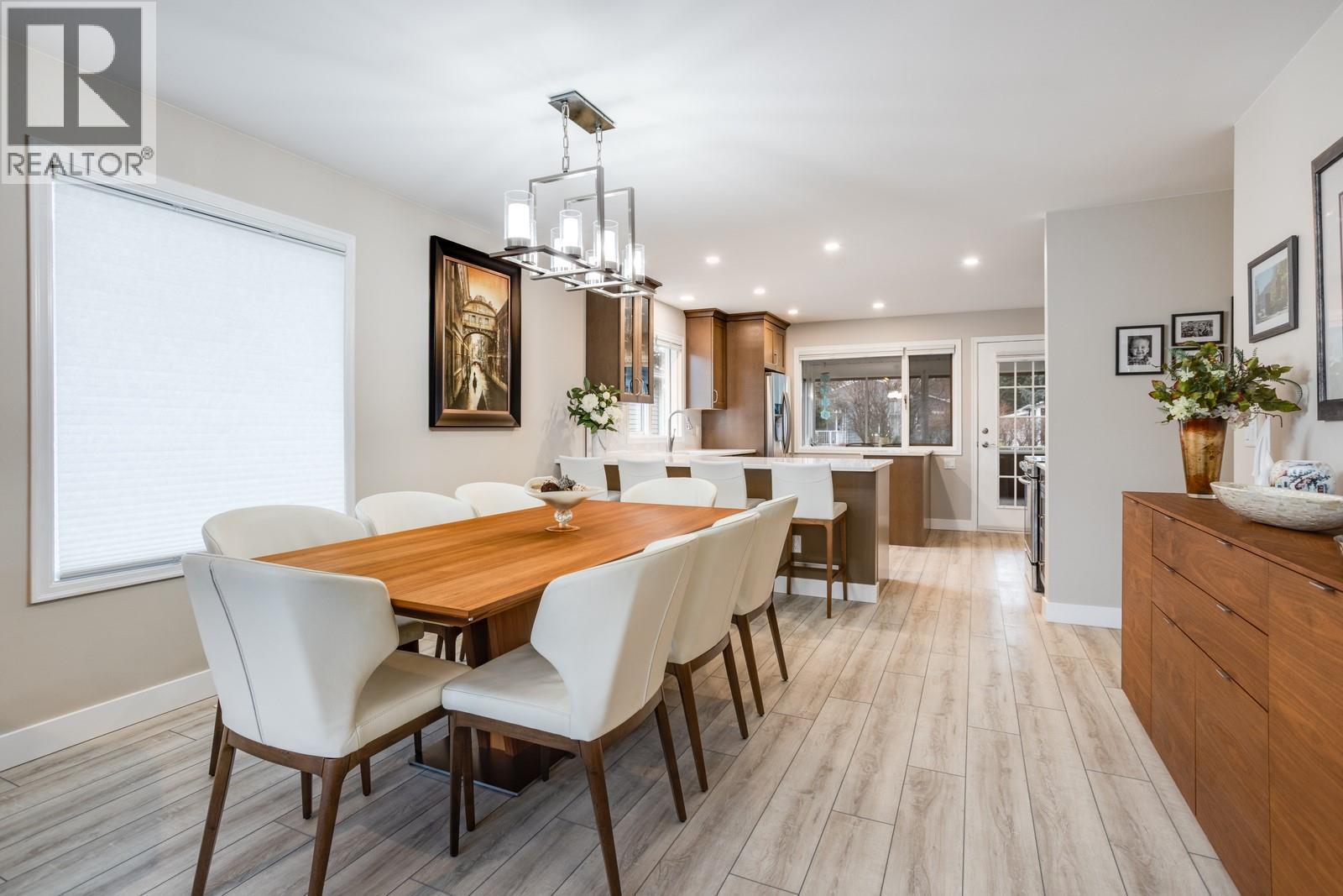 Open dining space ideal for hosting family and friends. - 1255 Raymer Avenue Unit# 507, Kelowna, BC - Indoor Photo Showing Dining Room
