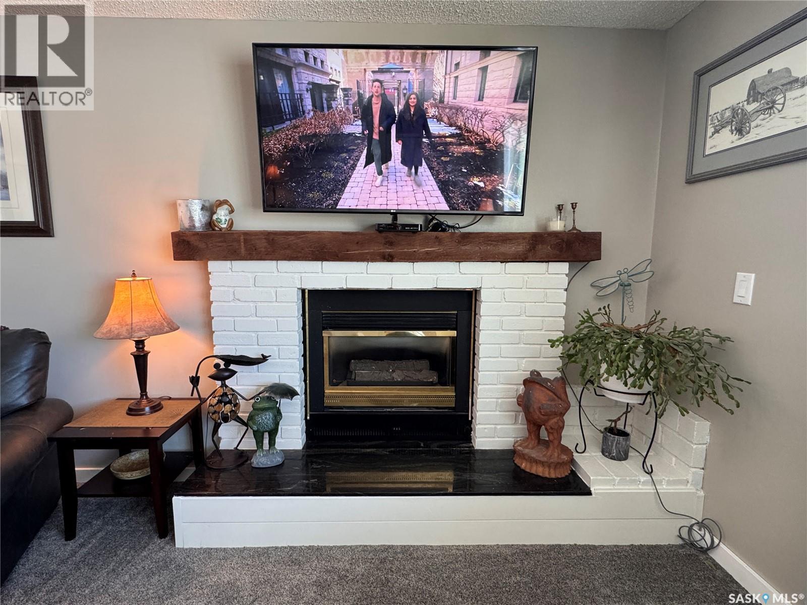 415 3Rd Avenue W, Biggar, SK - Indoor With Fireplace