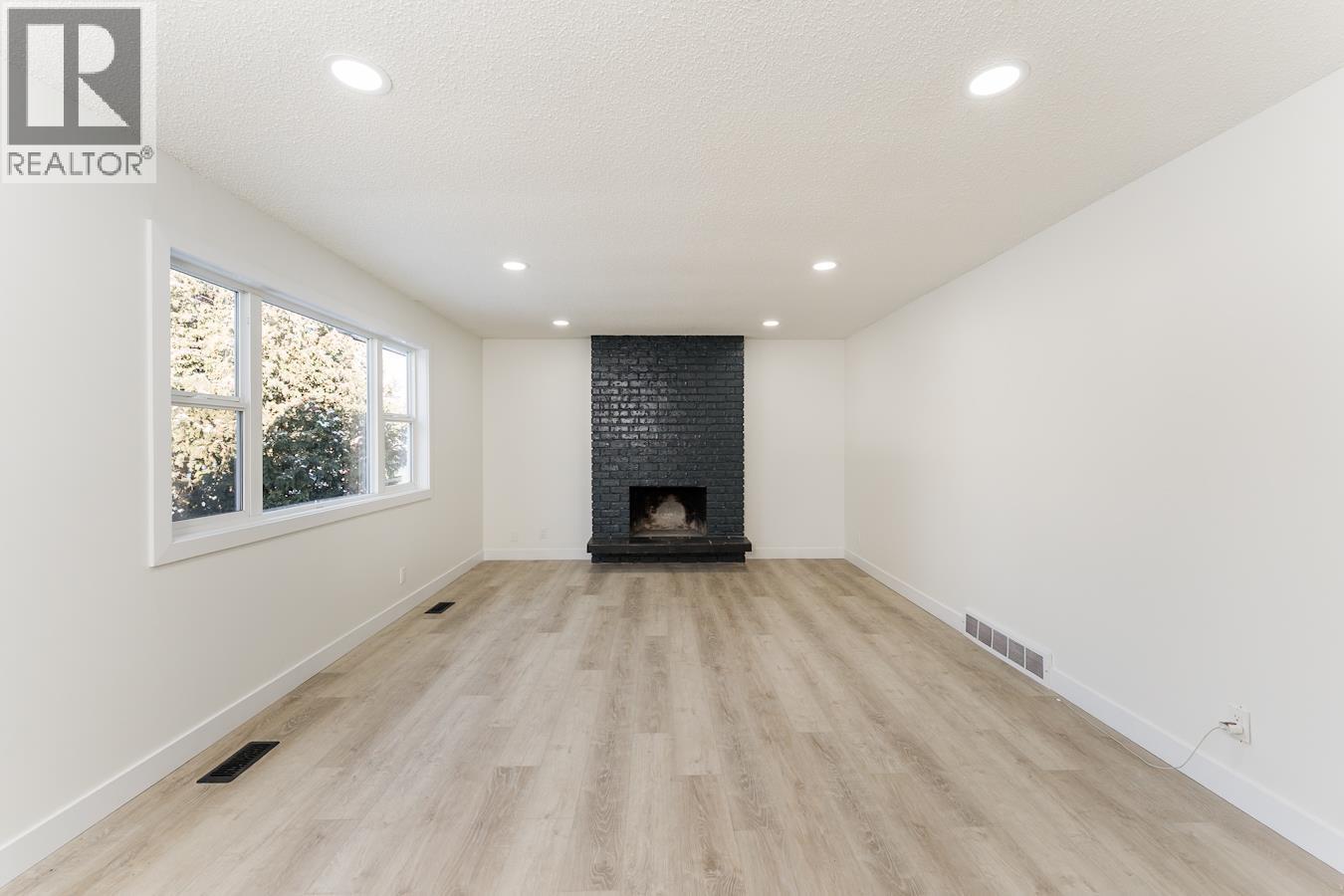 7790 Queens Crescent, Prince George, BC - Indoor With Fireplace