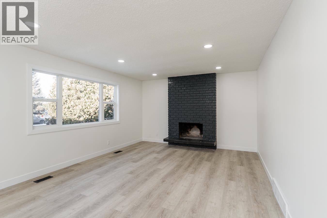 7790 Queens Crescent, Prince George, BC - Indoor With Fireplace