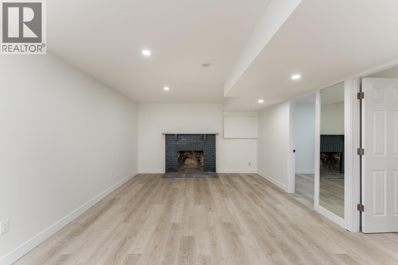 7790 Queens Crescent, Prince George, BC - Indoor Photo Showing Living Room With Fireplace