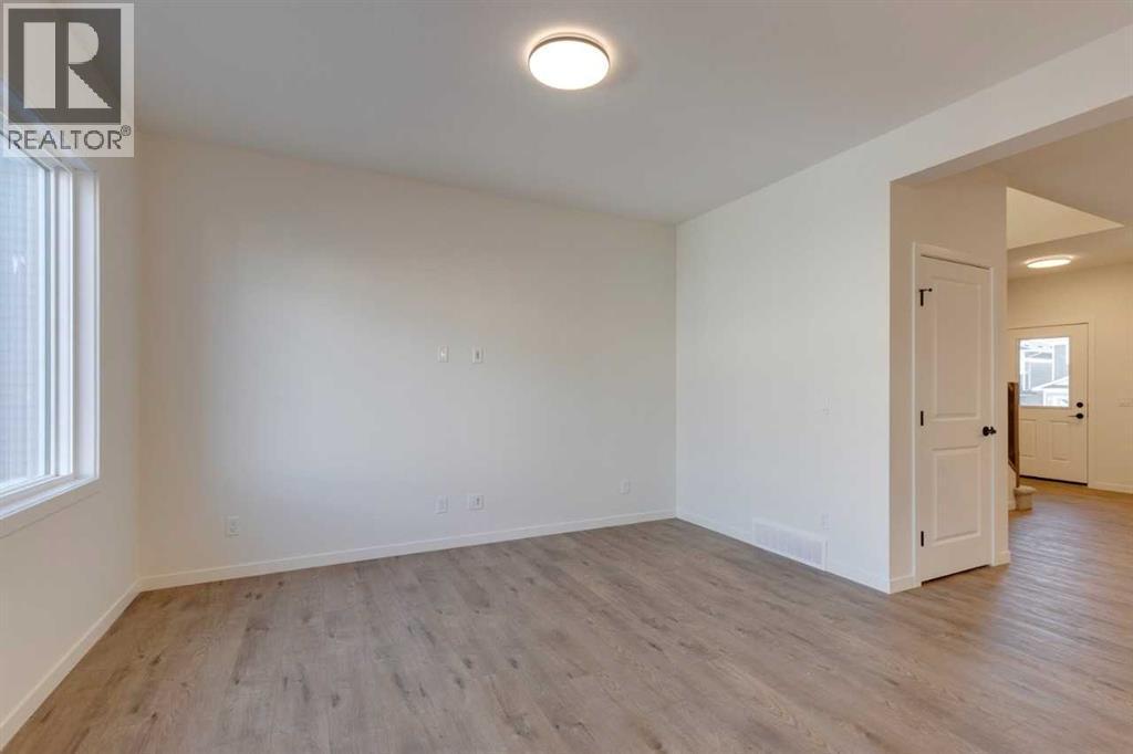 1379 Bayview Crescent Sw, Airdrie, AB - Indoor Photo Showing Other Room