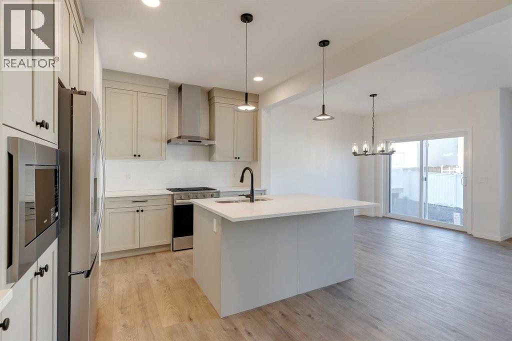 1379 Bayview Crescent Sw, Airdrie, AB - Indoor Photo Showing Kitchen With Upgraded Kitchen