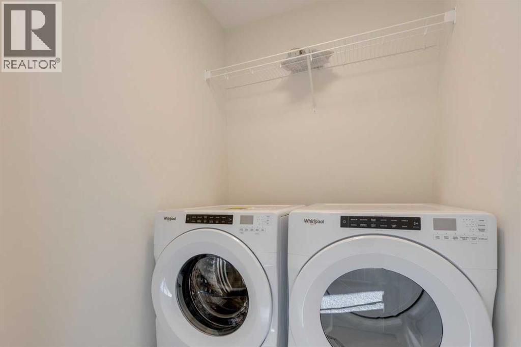 1379 Bayview Crescent Sw, Airdrie, AB - Indoor Photo Showing Laundry Room
