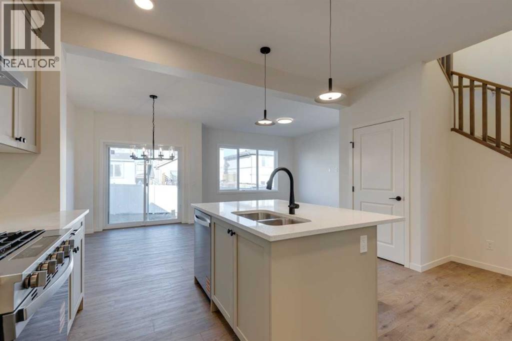 1379 Bayview Crescent Sw, Airdrie, AB - Indoor Photo Showing Kitchen With Double Sink With Upgraded Kitchen