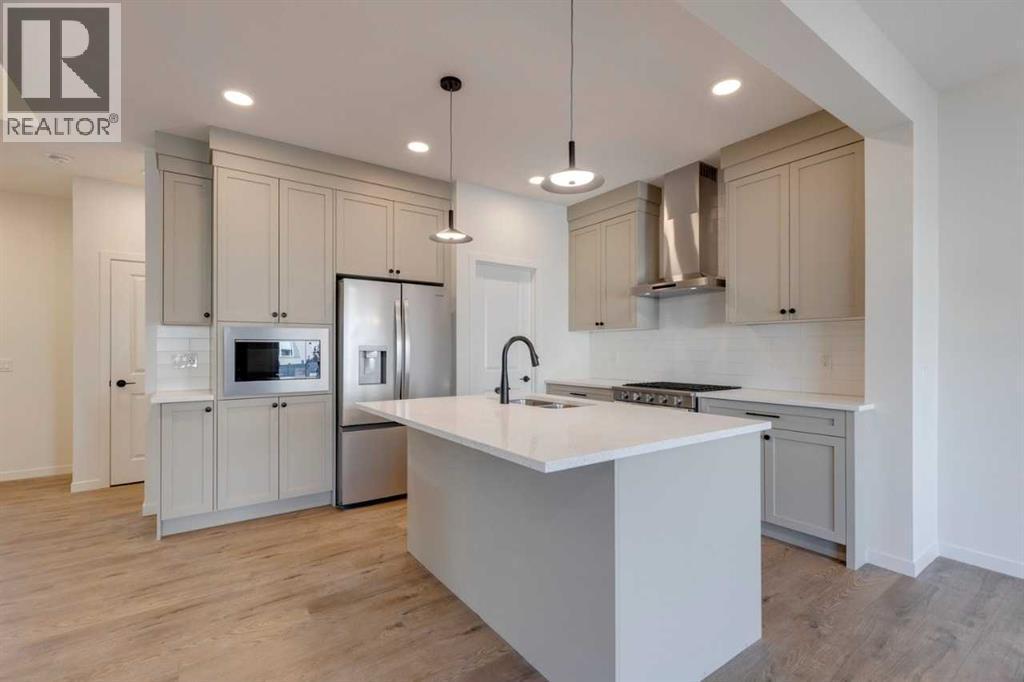 1379 Bayview Crescent Sw, Airdrie, AB - Indoor Photo Showing Kitchen With Upgraded Kitchen