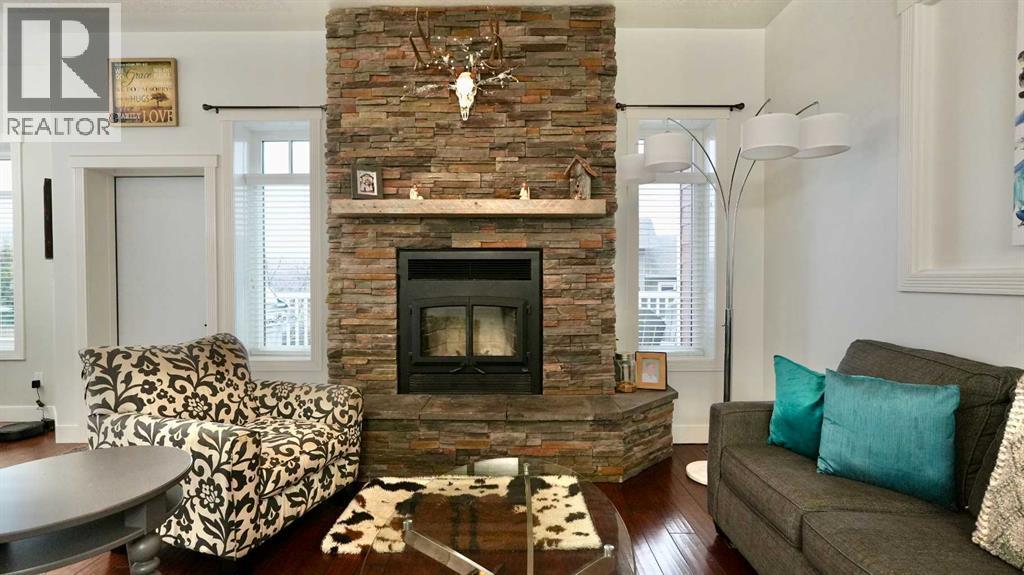 8245 102 Avenue, Peace River, AB - Indoor Photo Showing Living Room With Fireplace