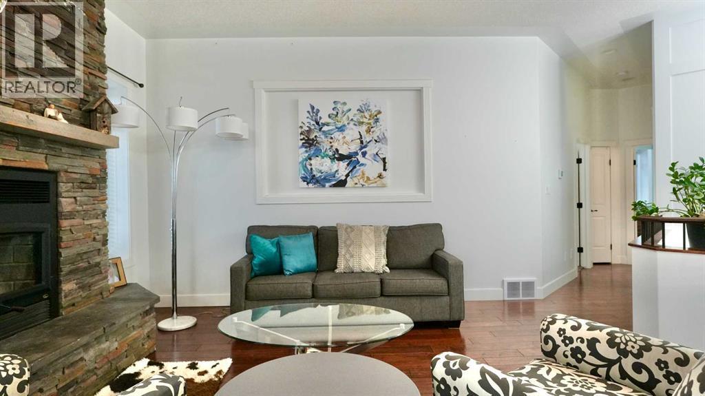 8245 102 Avenue, Peace River, AB - Indoor Photo Showing Living Room With Fireplace