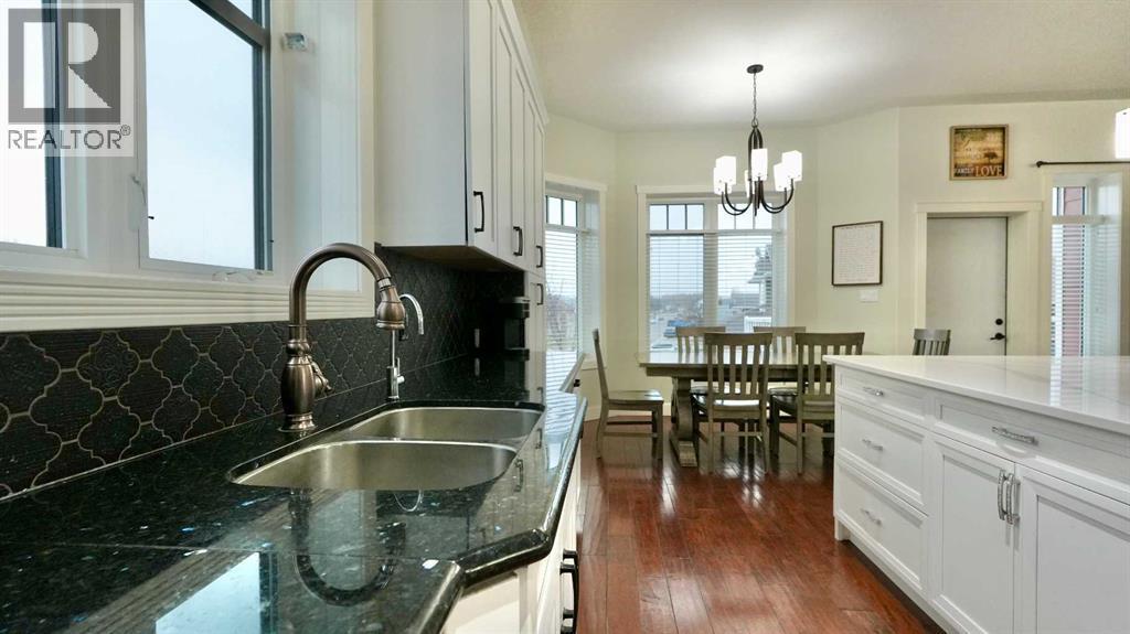 8245 102 Avenue, Peace River, AB - Indoor Photo Showing Kitchen With Double Sink
