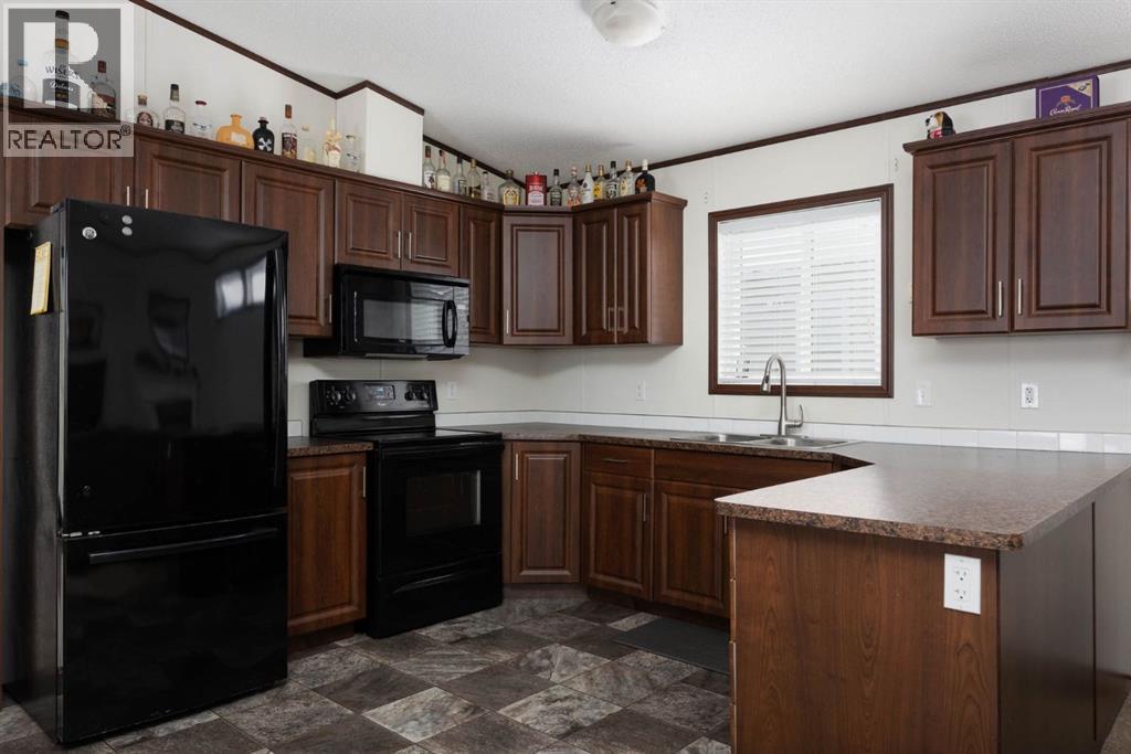 328 Grey Crescent, Fort Mcmurray, AB - Indoor Photo Showing Kitchen With Double Sink