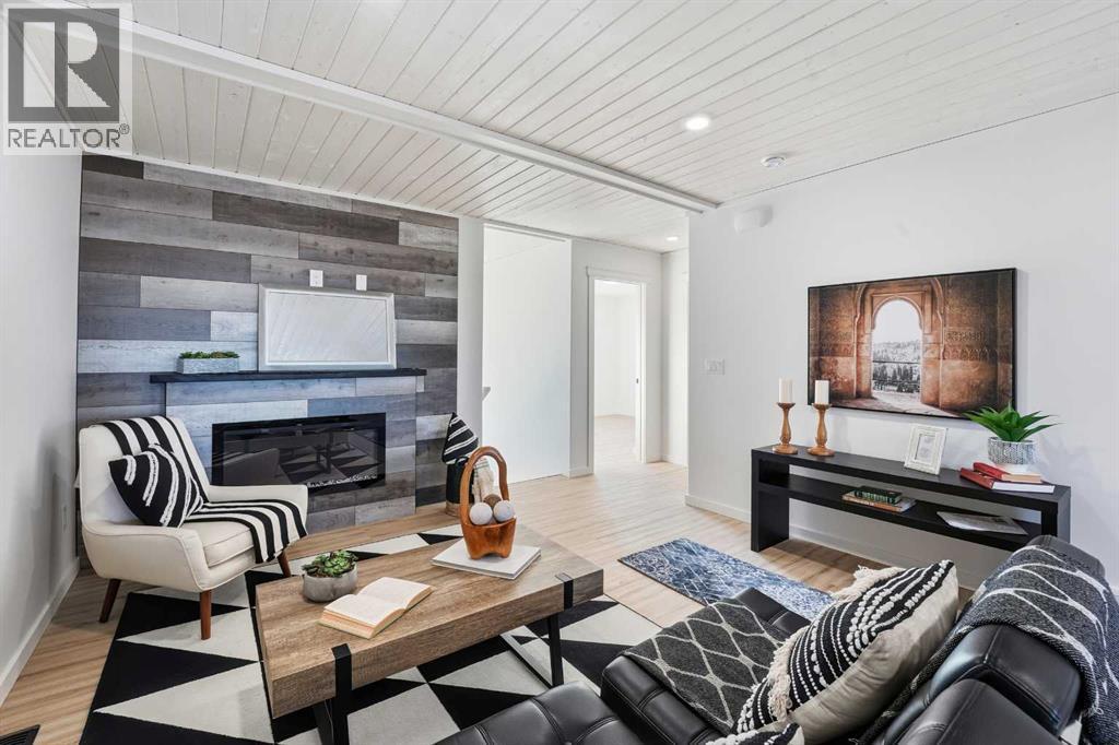 6 Metcalf Way, Lacombe, AB - Indoor Photo Showing Living Room With Fireplace
