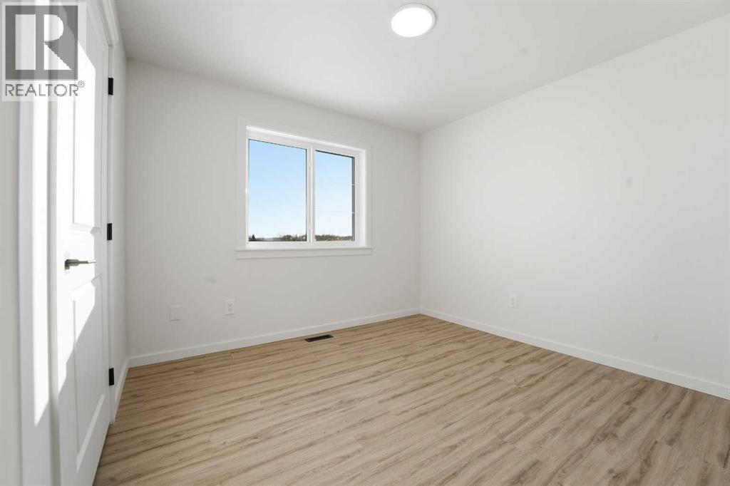 6 Metcalf Way, Lacombe, AB - Indoor Photo Showing Other Room