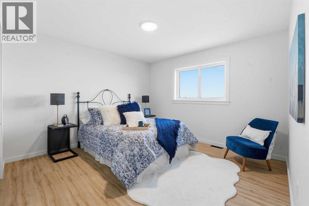 6 Metcalf Way, Lacombe, AB - Indoor Photo Showing Bedroom