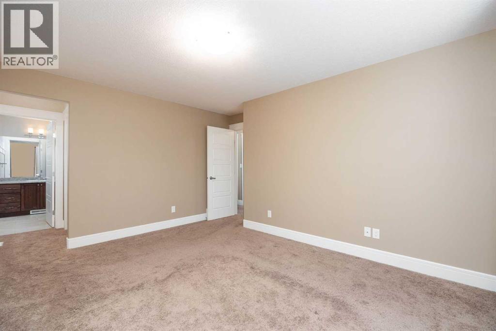 Primary Bedroom with ensuite - 197 Snowy Owl Way Nw, Fort Mcmurray, AB - Indoor Photo Showing Other Room
