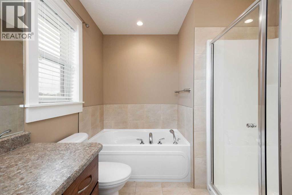 Primary Ensuite with Stand Alone Shower - 197 Snowy Owl Way Nw, Fort Mcmurray, AB - Indoor Photo Showing Bathroom