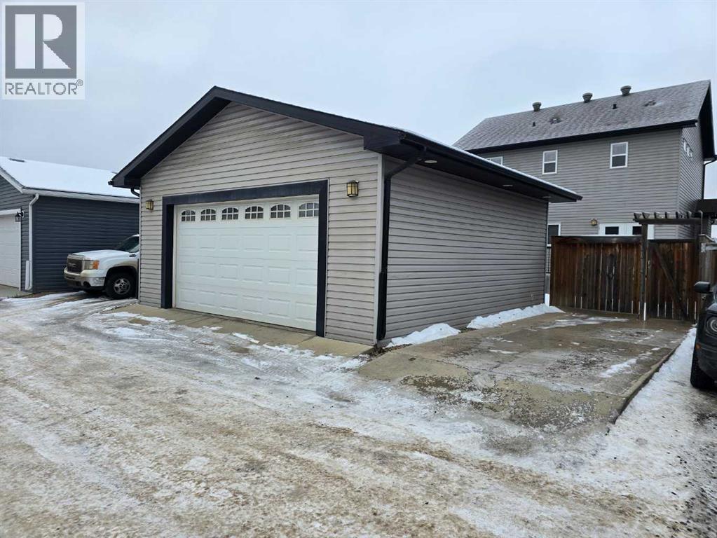 Parking with plug in - 197 Snowy Owl Way Nw, Fort Mcmurray, AB - Outdoor With Exterior