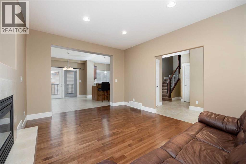 View of diningroom and entrance from livingroom - 197 Snowy Owl Way Nw, Fort Mcmurray, AB - Indoor With Fireplace