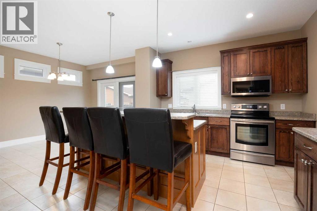 Kitchen with island - 197 Snowy Owl Way Nw, Fort Mcmurray, AB - Indoor