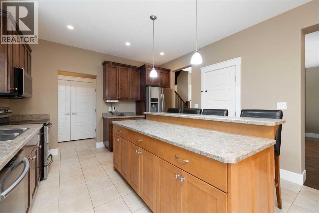 Kitchen alternate view of island - 197 Snowy Owl Way Nw, Fort Mcmurray, AB - Indoor Photo Showing Kitchen With Double Sink