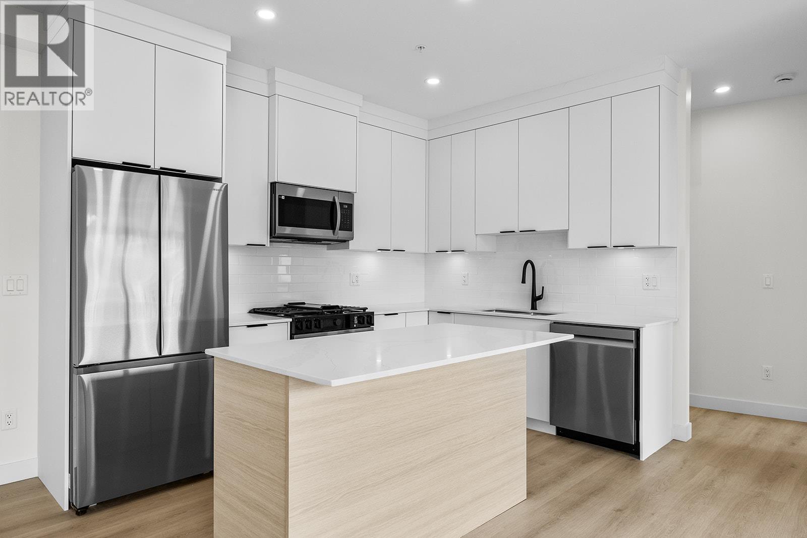 Photos may be of a similar home in the community - 5300 Main Street Unit# 202, Kelowna, BC - Indoor Photo Showing Kitchen With Stainless Steel Kitchen With Upgraded Kitchen
