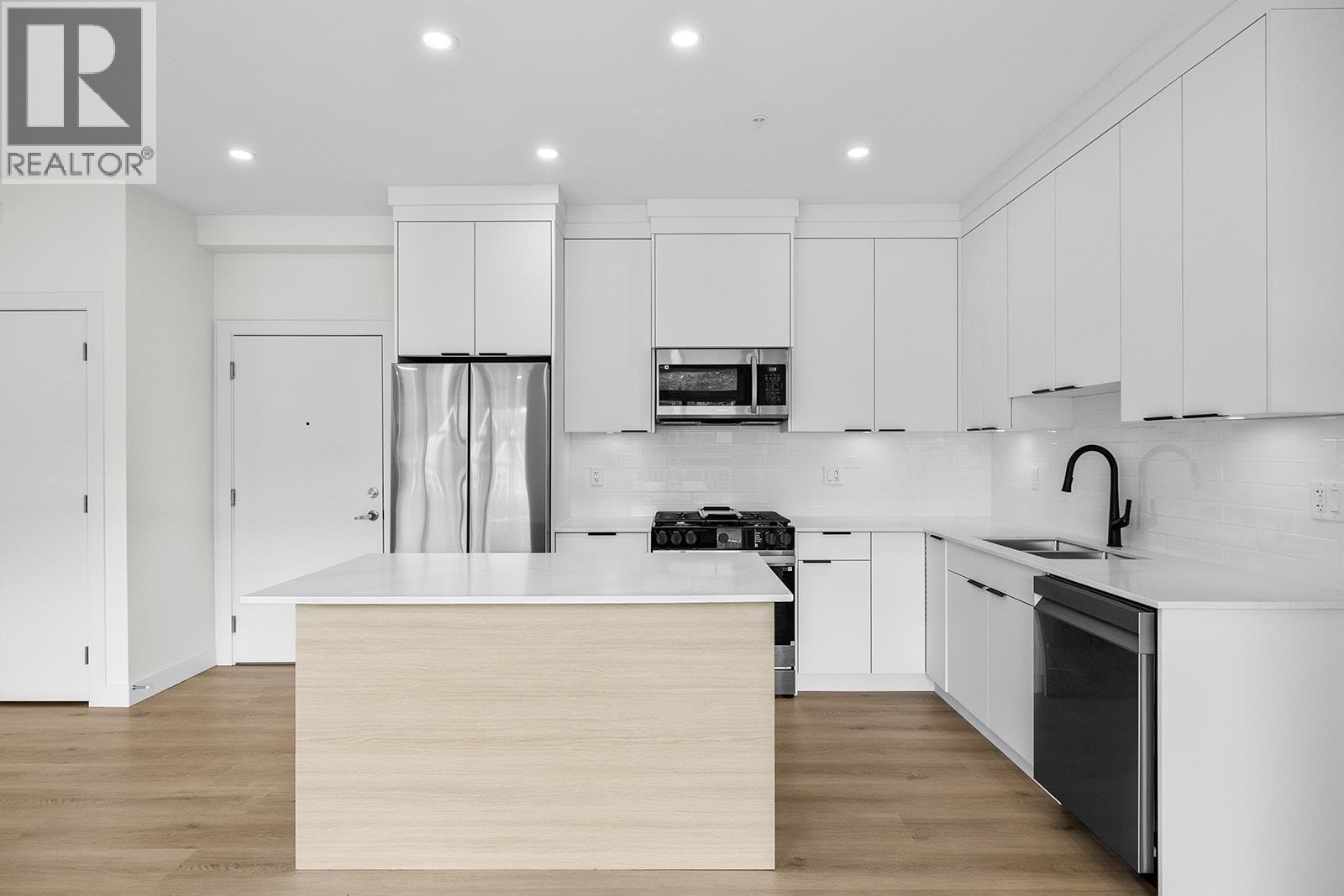 Photos may be of a similar home in the community - 5300 Main Street Unit# 202, Kelowna, BC - Indoor Photo Showing Kitchen With Stainless Steel Kitchen With Upgraded Kitchen