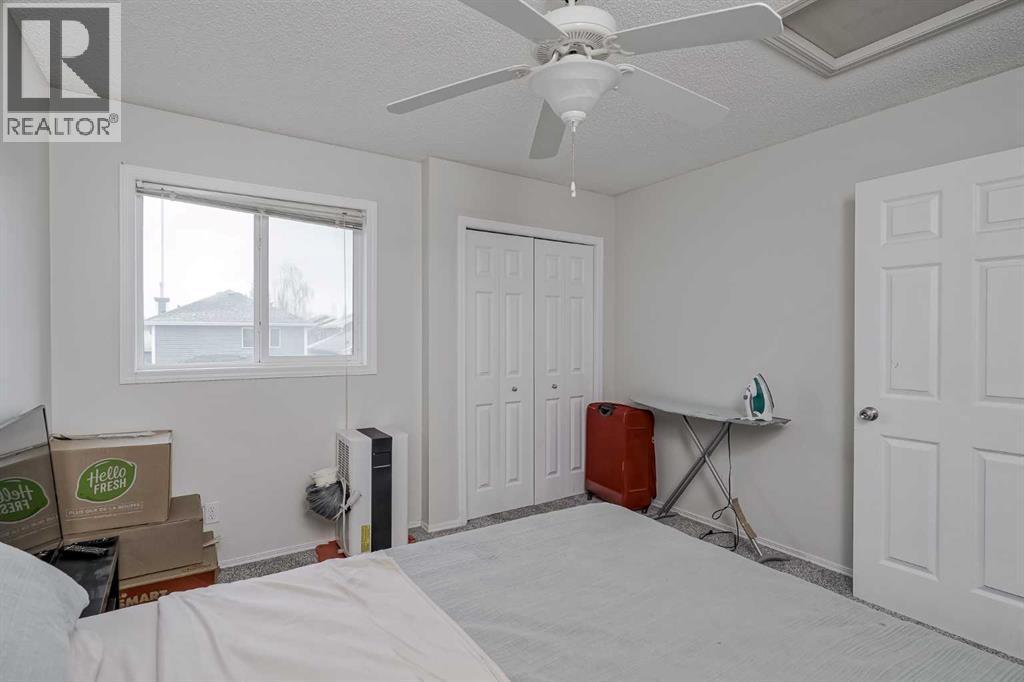 222 Bridleridge Way Sw, Calgary, AB - Indoor Photo Showing Bedroom