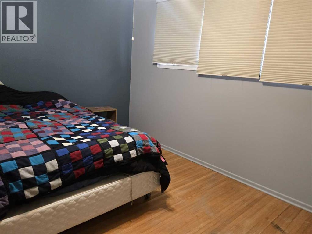 Primary Bedroom - 101 Simpson Street, Hinton, AB - Indoor Photo Showing Bedroom
