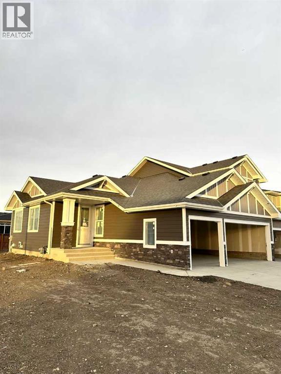 277 Waterford Way, Chestermere, AB - Outdoor With Facade