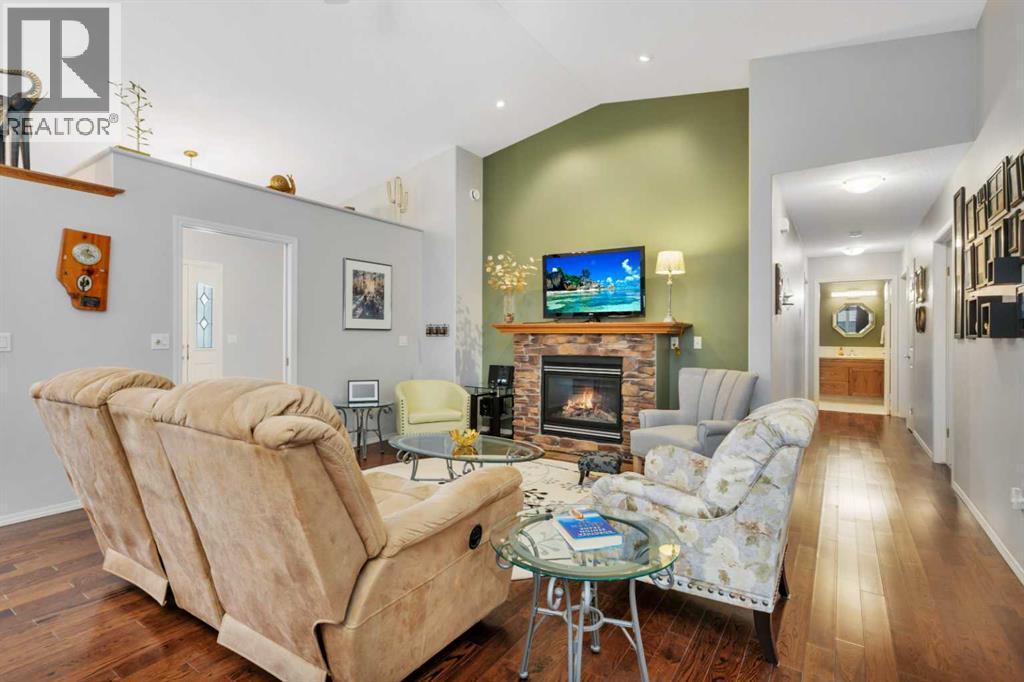 605 5 Street Sw, Sundre, AB - Indoor Photo Showing Living Room With Fireplace