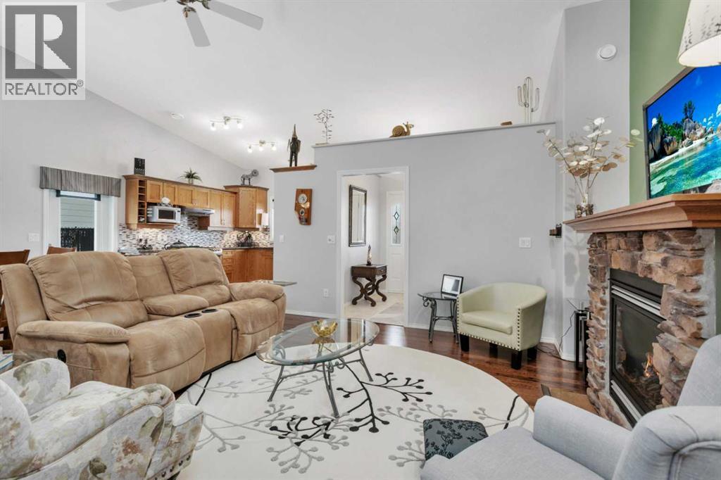 605 5 Street Sw, Sundre, AB - Indoor Photo Showing Living Room With Fireplace