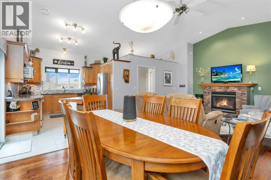 605 5 Street Sw, Sundre, AB - Indoor Photo Showing Dining Room With Fireplace