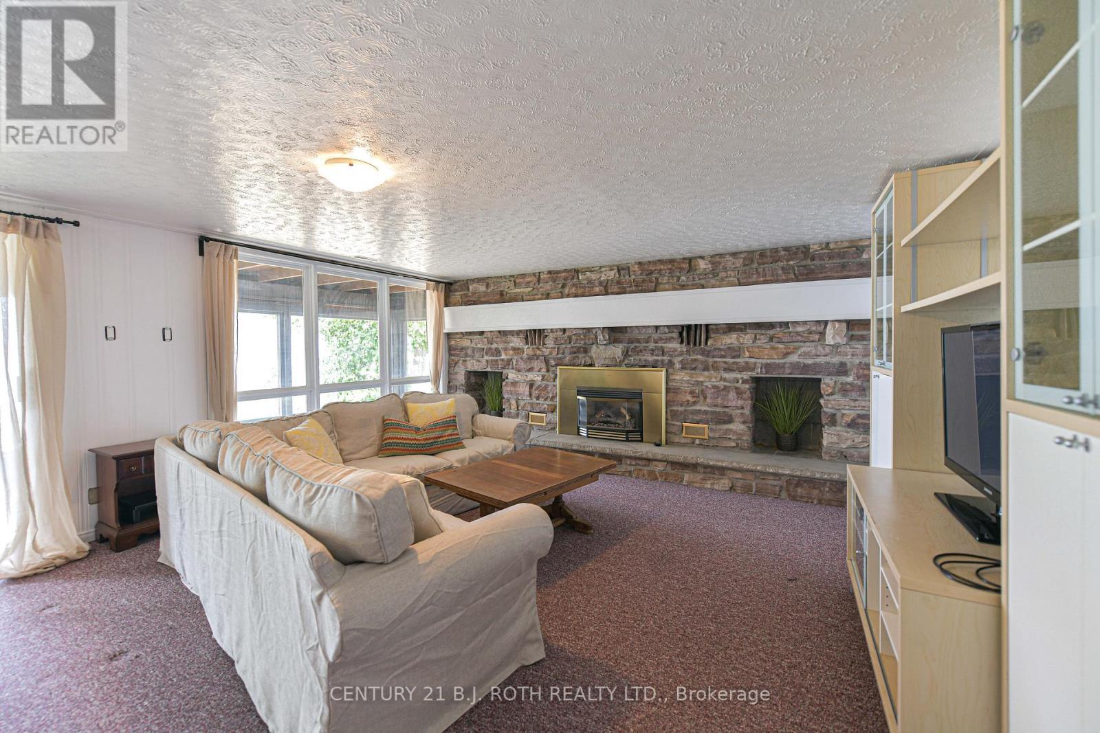71 Campbell Beach Road, Kawartha Lakes, ON - Indoor Photo Showing Other Room With Fireplace