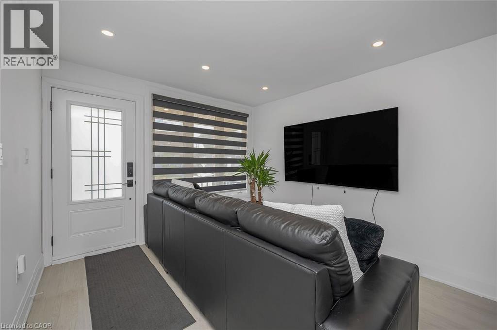 Living room with light wood-type flooring and recessed lighting - 525 Britannia Avenue, Hamilton, ON - Indoor