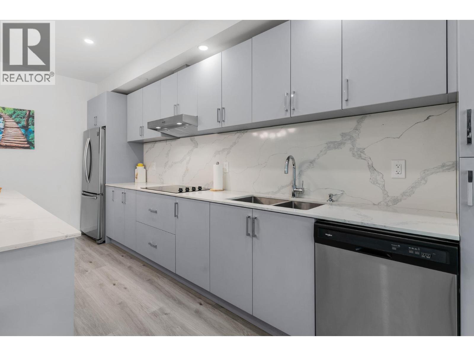 880 Saucier Avenue Unit# 207, Kelowna, BC - Indoor Photo Showing Kitchen With Stainless Steel Kitchen With Double Sink