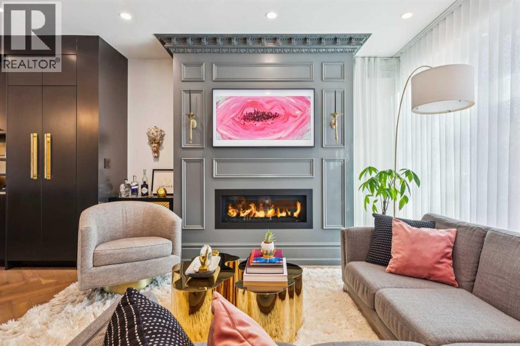 FRAME TV ABOVE THE FIREPLACE IS INCLUDED - 3813 1A Street Sw, Calgary, AB - Indoor Photo Showing Living Room With Fireplace