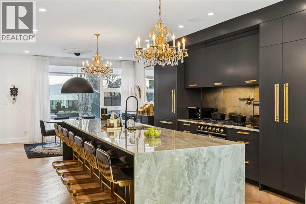 SHOWSTOPPER CHEF'S KITCHEN INCLUDES LA CORNUE RANGE, FULL SET OF SUBZERO FRIDGES AND FREEZER DRAWERS AND 2 DISHWASHERS - 3813 1A Street Sw, Calgary, AB - Indoor Photo Showing Kitchen With Upgraded Kitchen