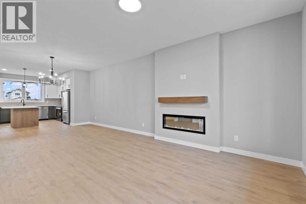 191 Belvedere Crescent Se, Calgary, AB - Indoor Photo Showing Living Room With Fireplace