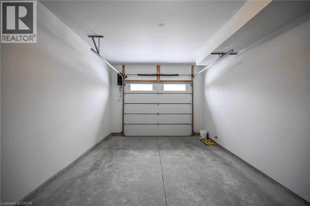 Insulated garage with garage door opener. - 45B Howard Street, Hagersville, ON - Indoor Photo Showing Garage