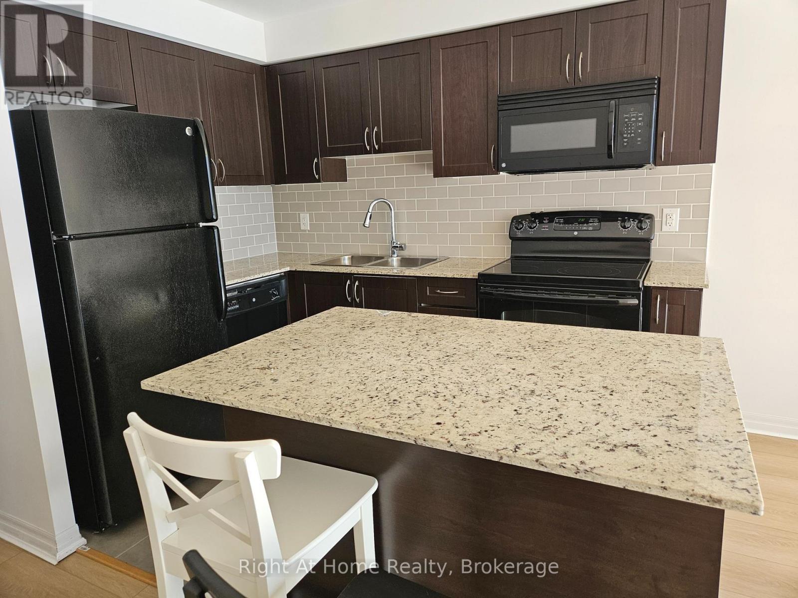 1506 - 1940 Ironstone Drive, Burlington (Uptown), ON - Indoor Photo Showing Kitchen With Double Sink