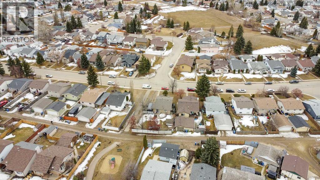 Aerial photo looking SW towards Eastview Estates Park & Community Hall - 69 Erickson Drive, Red Deer, AB - With View
