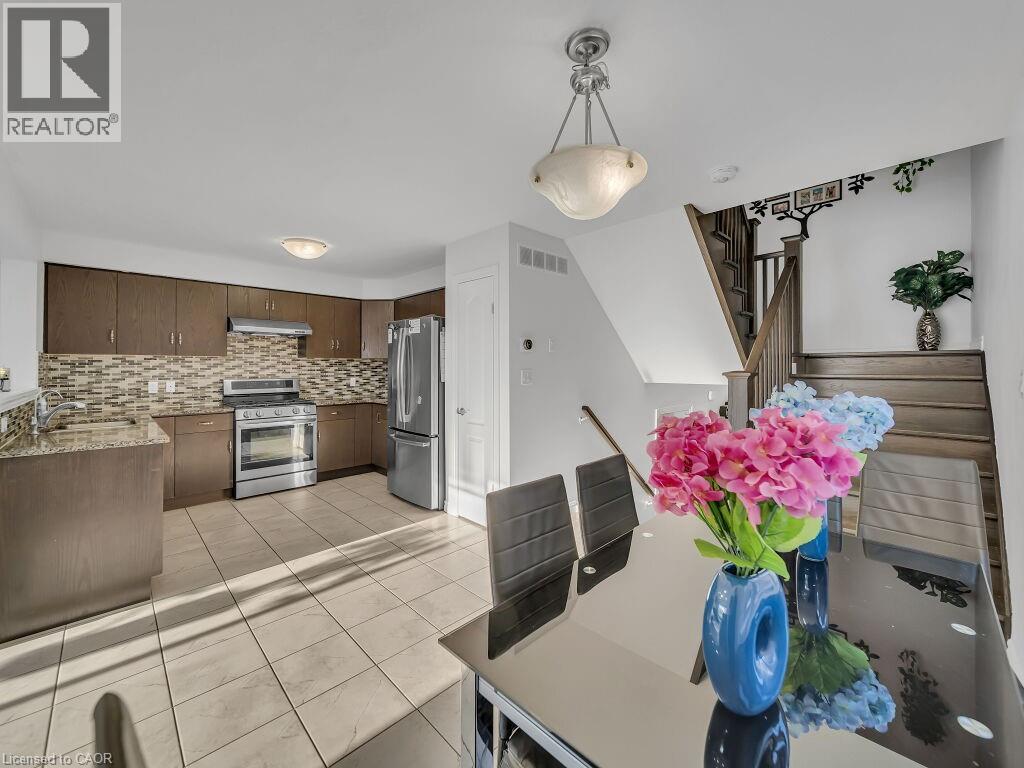 Dining area with light tile patterned flooring - 144 Summit Ridge Drive, Guelph, ON - Indoor