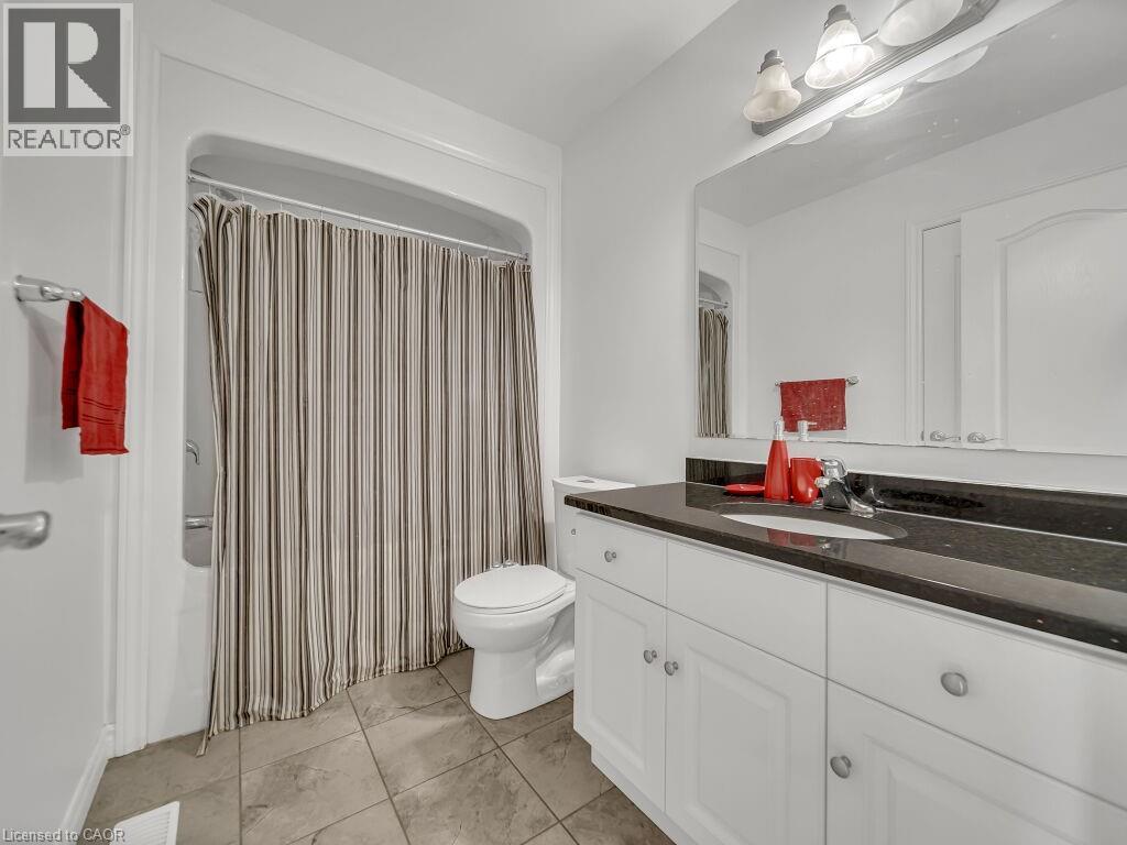 Full bathroom featuring vanity and shower / tub combo with curtain - 144 Summit Ridge Drive, Guelph, ON - Indoor Photo Showing Bathroom